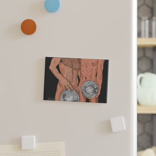 Canvas print of a person holding a disco ball on a wall with decorative hooks.